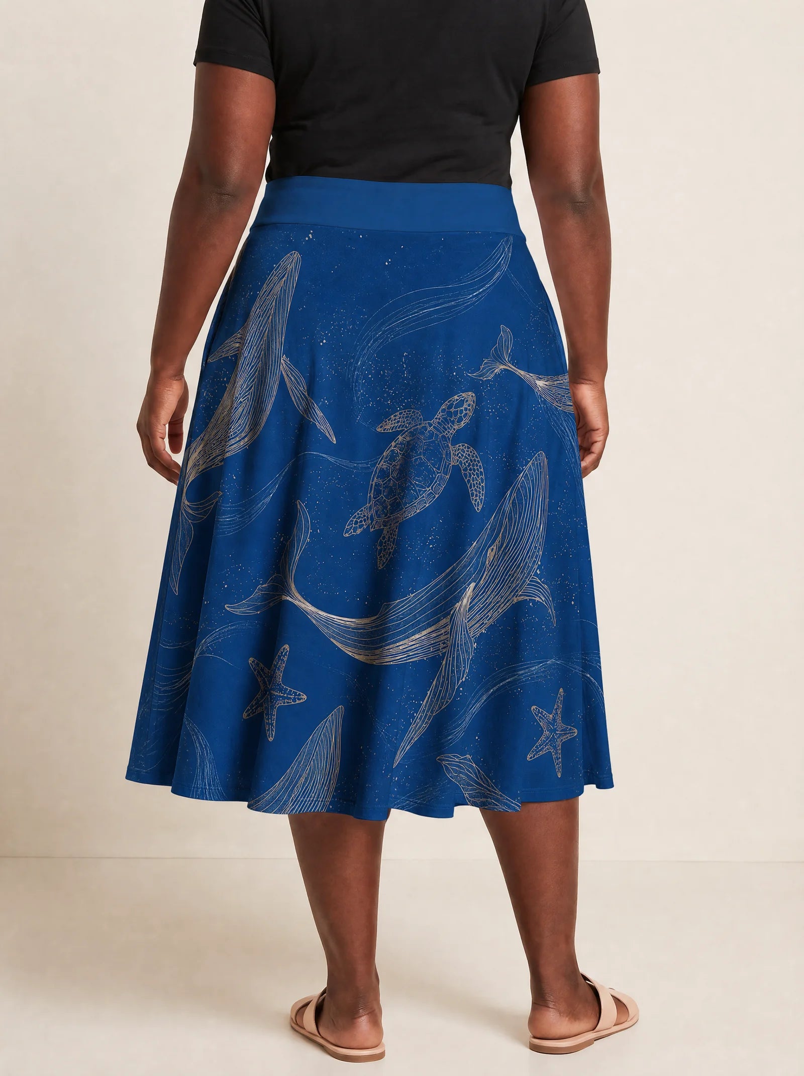 "Pwani" Twirl Skirt — cropped back view on model