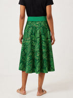 "Asili Emerald" Twirl Skirt — cropped back view on model