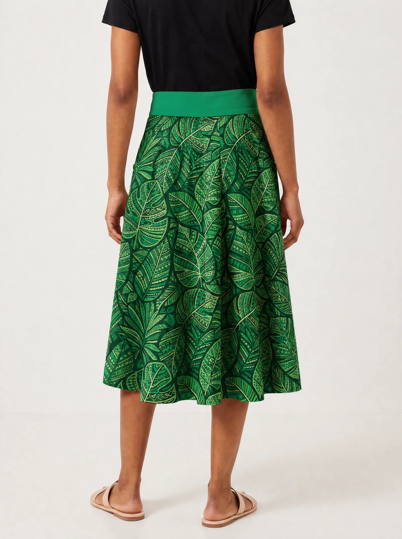 "Asili Emerald" Twirl Skirt — cropped back view on model