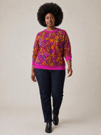 "Waridi" Sweatshirt — three-quarter view on model