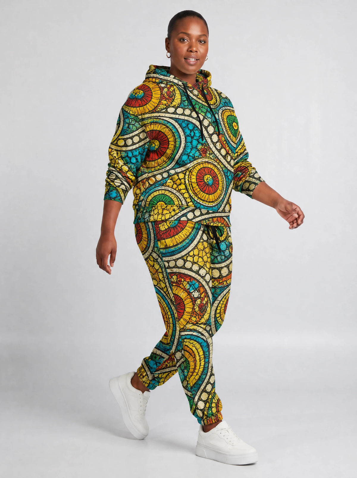 "Taji" Hoodie & Jogger Set — walking three-quarter view on model