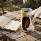 Feeling Blacknificient Tumbler — on a garden table beside an open book