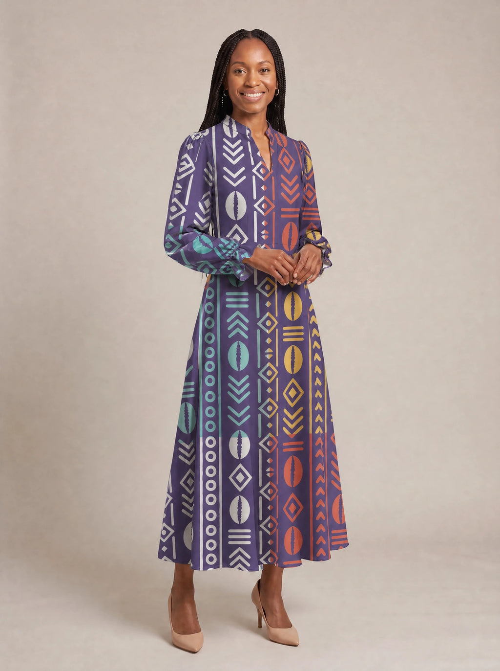 "Oshun Zamani" Long Puff Sleeve Dress — walking, three-quarter view on model