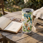 "Ndege" Tumbler — on a garden table beside an open book