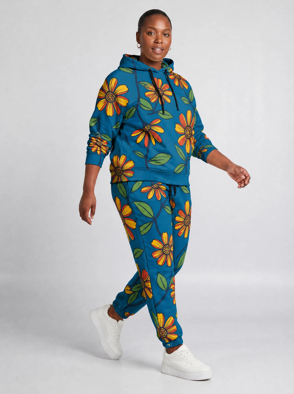 "Kitalu" Teal Poppy Hoodie & Jogger Set — walking three-quarter view on model