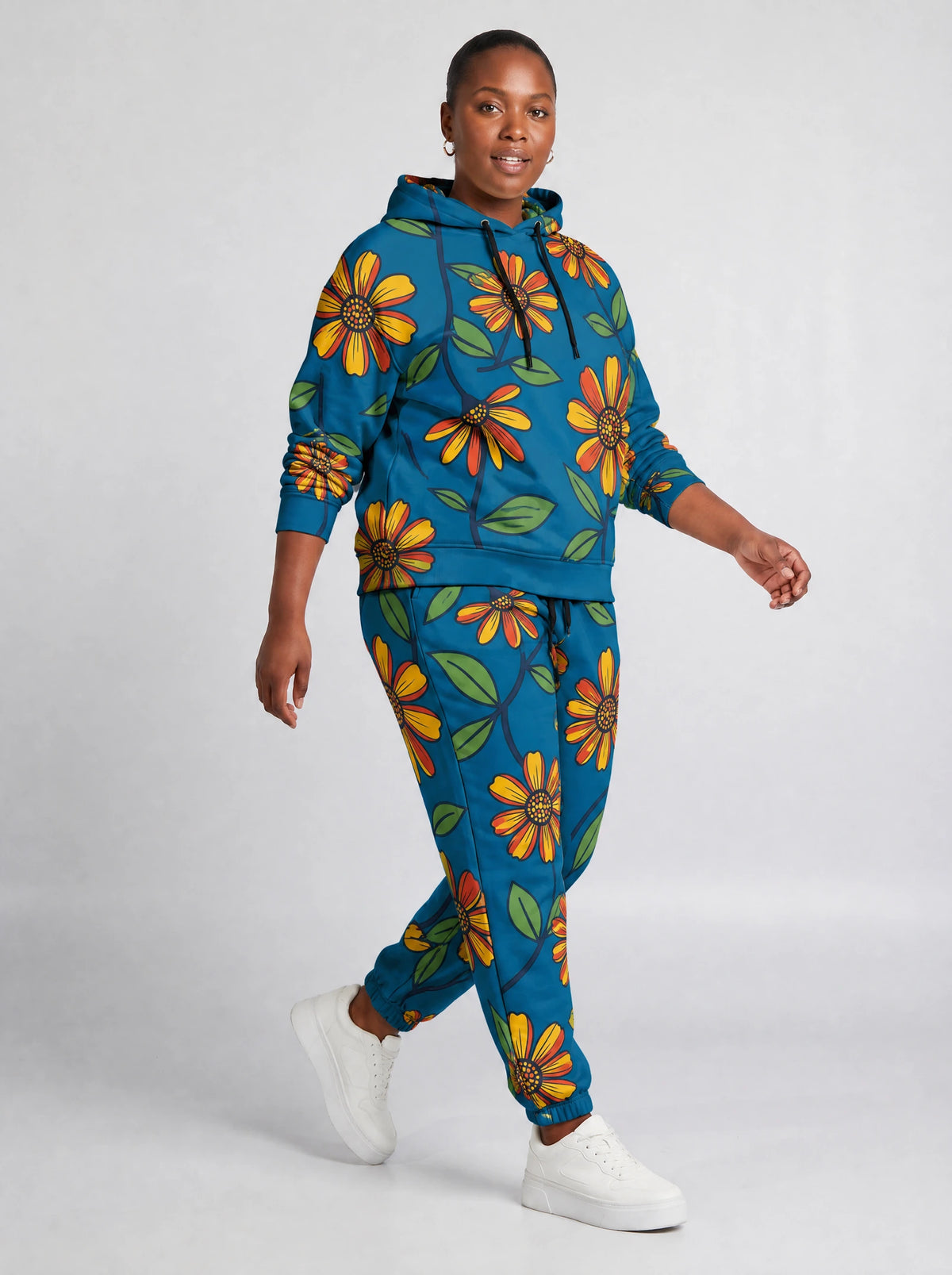 "Kitalu" Teal Poppy Hoodie & Jogger Set — walking three-quarter view on model