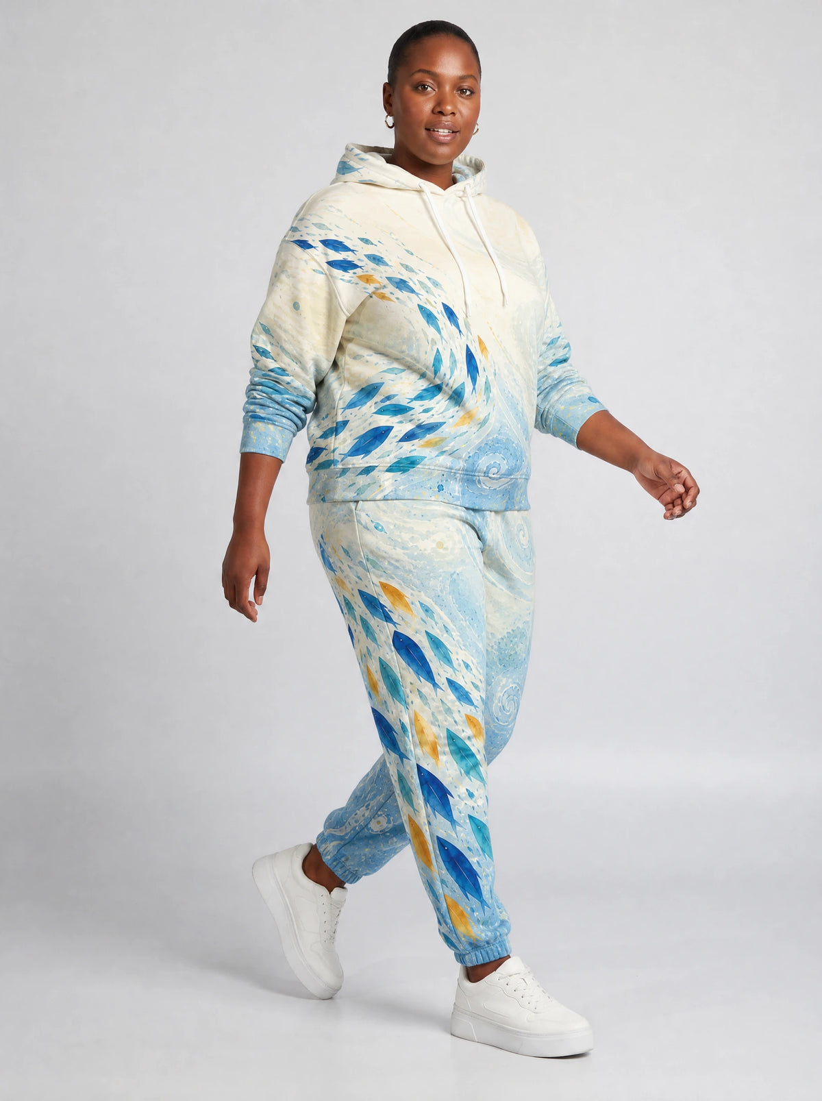 "Samaki" Hoodie & Jogger Set — walking three-quarter view on model