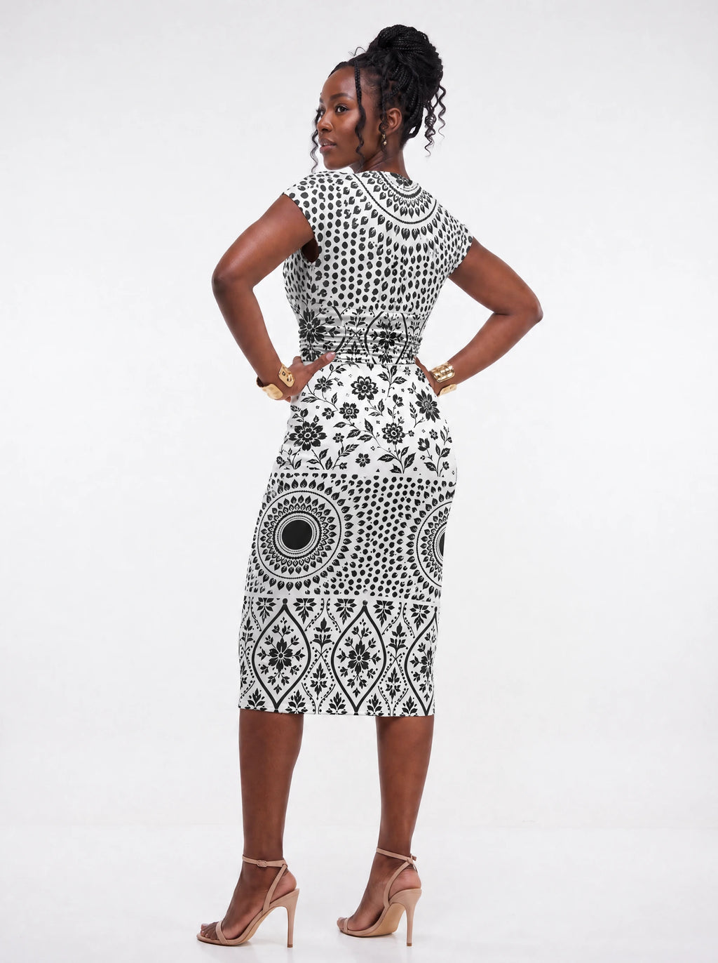 "Mwanga" Cap Sleeve Midi Dress — three-quarter view on model