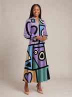 "Sanaa" Long Puff Sleeve Dress — walking, three-quarter view on model