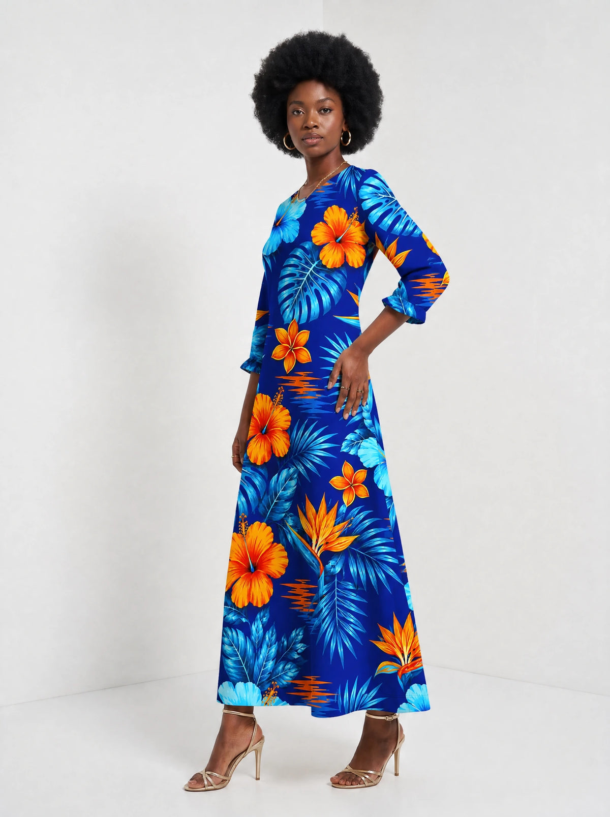 "Maua" Long Sleeve Maxi Dress — walking, three-quarter view on model