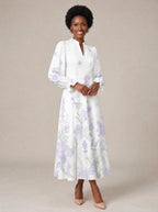"Urujuani" Long Puff Sleeve Dress — walking, three-quarter view on model