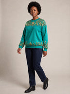 "Heshima" Sweatshirt — three-quarter view on model