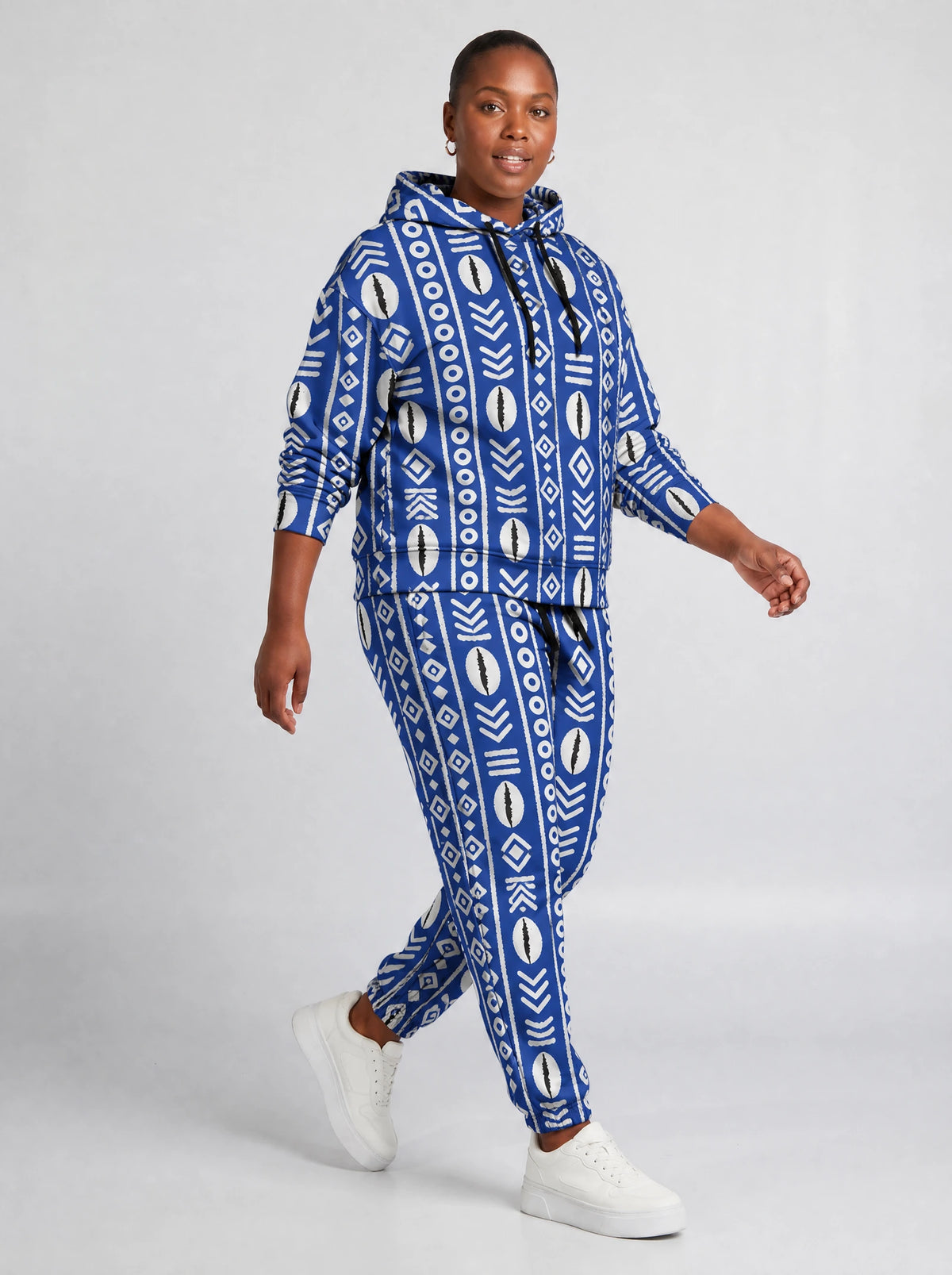 "Oshun" Royal Blue Hoodie & Jogger Set — walking three-quarter view on model