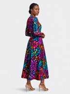 "Rangi" Viscose Midi Dress — three-quarter view on model, hand in the side pocket