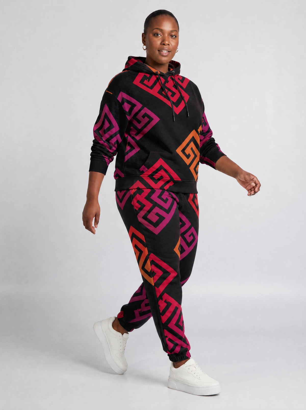 "Kiungo" Black Berry Hoodie & Jogger Set — walking three-quarter view on model