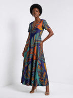 "Majani" Short Sleeve Maxi Dress — walking, three-quarter view on model