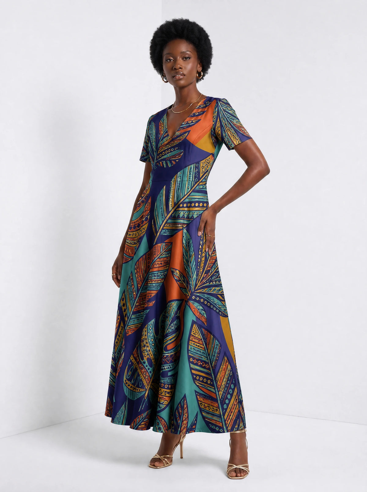 "Majani" Short Sleeve Maxi Dress — walking, three-quarter view on model