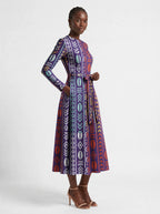 "Oshun Zamani" Viscose Midi Dress — three-quarter view on model, hand in the side pocket