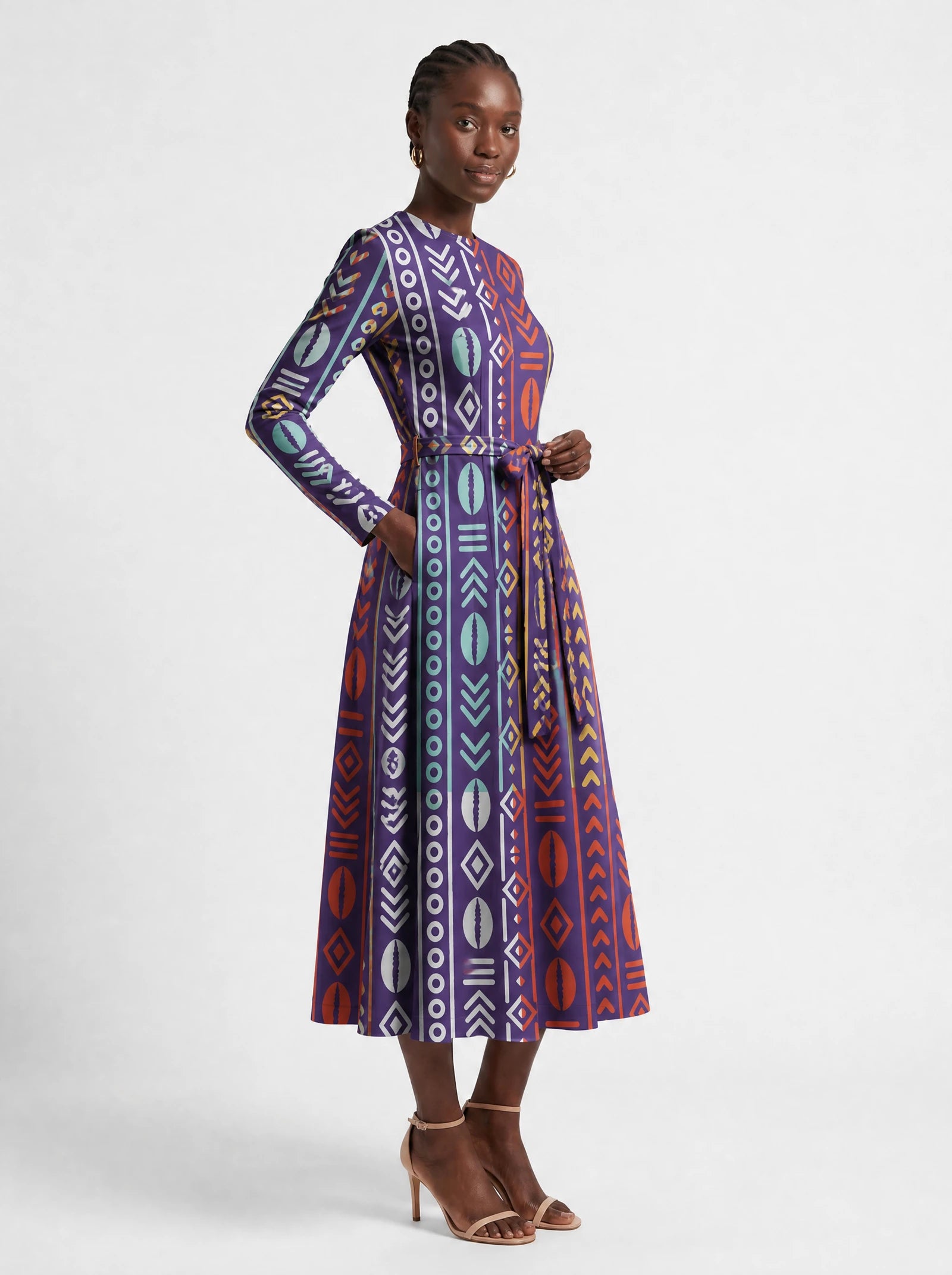 "Oshun Zamani" Viscose Midi Dress — three-quarter view on model, hand in the side pocket