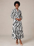 "Milia" Long Puff Sleeve Dress — walking, three-quarter view on model