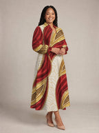 "Utukufu" Long Puff Sleeve Dress — walking, three-quarter view on model