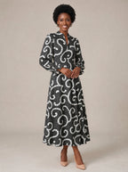 "Duara" Long Puff Sleeve Dress — walking, three-quarter view on model
