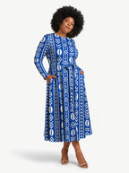 "Oshun" Viscose Midi Dress — three-quarter view on model, hand in the side pocket