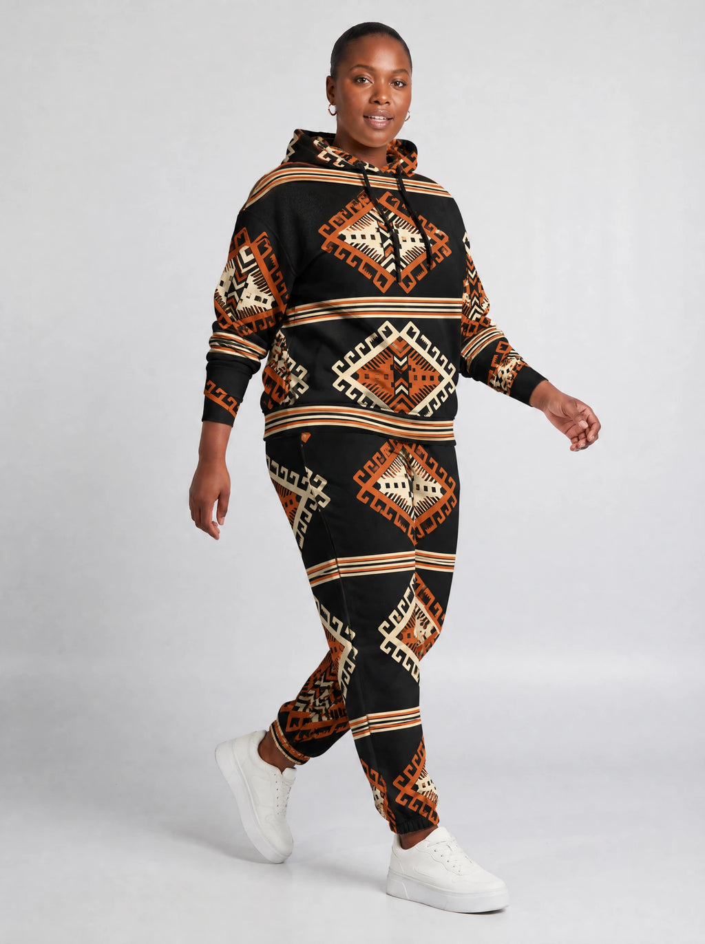 "Cheche" Black Ember Hoodie & Jogger Set — walking three-quarter view on model