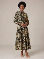 "Sahara" Long Puff Sleeve Dress — walking, three-quarter view on model