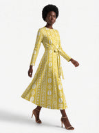 "Oshun Dhahabu" Viscose Midi Dress — three-quarter view on model, hand in the side pocket