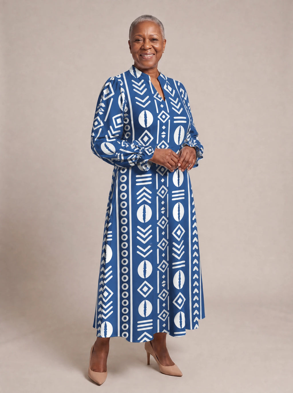 "Oshun" Royal Blue Long Puff Sleeve Dress — walking, three-quarter view on model