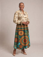 "Mto" Long Puff Sleeve Dress — walking, three-quarter view on model