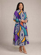 "Johari" Long Puff Sleeve Dress — walking, three-quarter view on model
