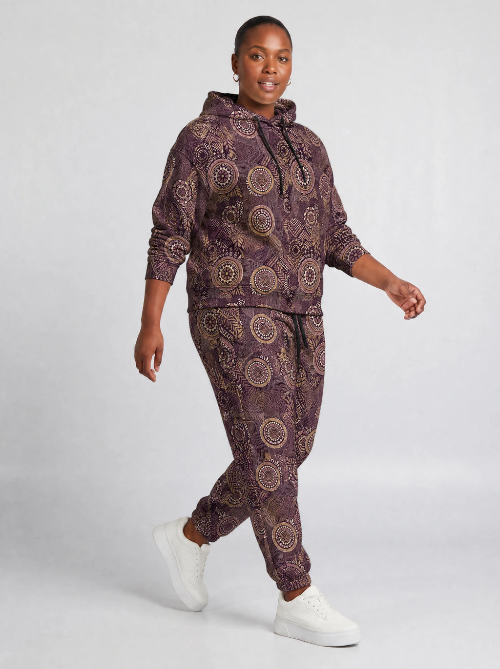 "Kitanzi" Plum Gold Hoodie & Jogger Set — walking three-quarter view on model
