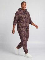 "Kitanzi" Plum Gold Hoodie & Jogger Set — walking three-quarter view on model