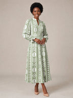 "Oshun Verde" Long Puff Sleeve Dress — walking, three-quarter view on model