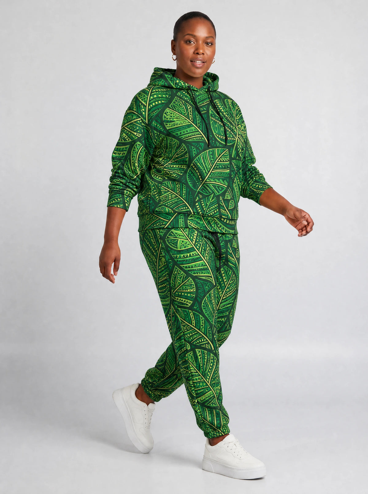 "Asili" Emerald Hoodie & Jogger Set — walking three-quarter view on model