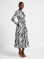 "Milia" Viscose Midi Dress — three-quarter view on model, hand in the side pocket