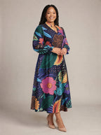"Bustani" Long Puff Sleeve Dress — walking, three-quarter view on model