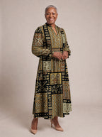 "Sankofa" Long Puff Sleeve Dress — walking, three-quarter view on model