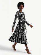 "Kuba" Viscose Midi Dress — three-quarter view on model, hand in the side pocket