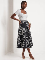 "Kivuli" Sweetheart Midi Dress — three-quarter view on model