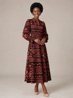 "Shaka" Burgundy Long Puff Sleeve Dress — walking, three-quarter view on model