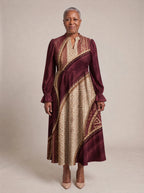 "Tapa" Long Puff Sleeve Dress — standing, angled view on model