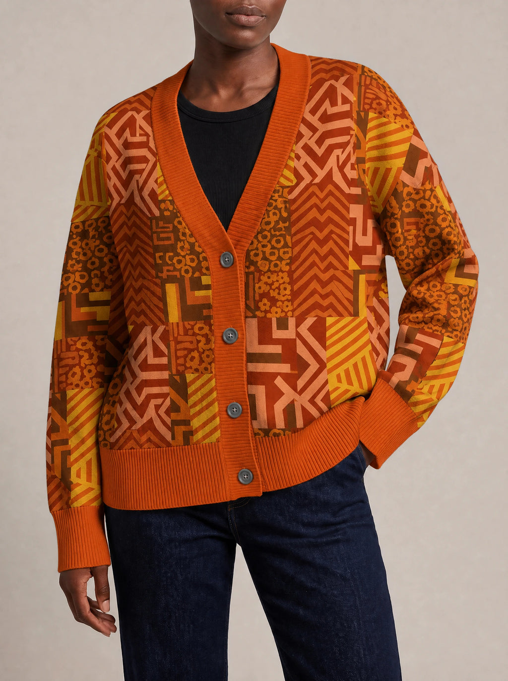 "Viraka" Knitted Cardigan — close view of the V-neck, buttons and ribbed trims