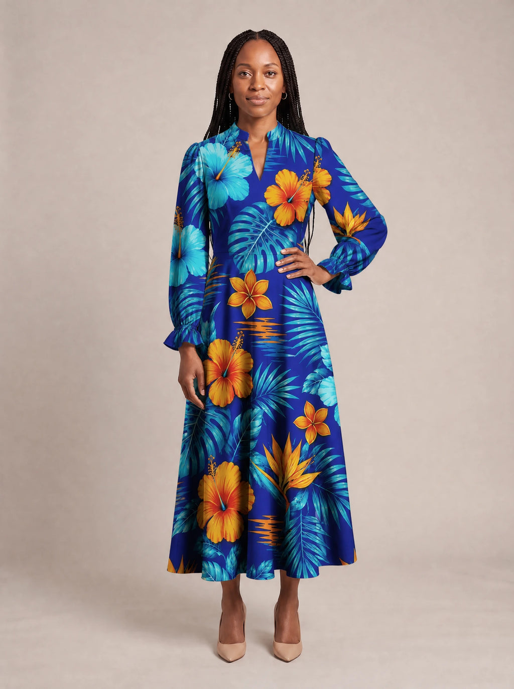 "Maua" Long Puff Sleeve Dress — standing, angled view on model