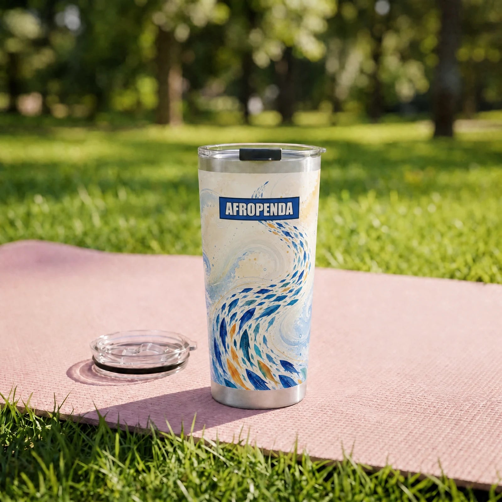 "Samaki" Tumbler — on a yoga mat on a park lawn