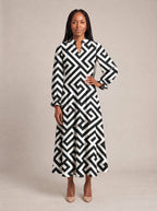 "Zamu" Long Puff Sleeve Dress — standing, angled view on model