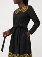 "Mamafo" Long Sleeve Midaxi Dress — standing, angled view on model