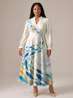 "Samaki" Long Puff Sleeve Dress — standing, angled view on model
